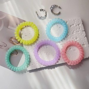 Five-pack spiral telephone cord hair ties in pastel macaron colors for women