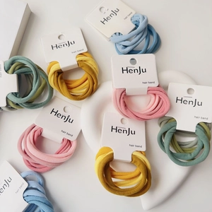 Set of 6 elastic hair bands in pastel colors on display cards for ponytail styling