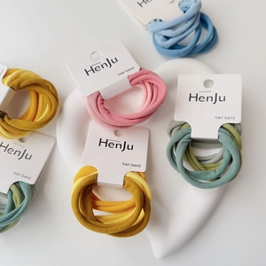 Set of high-elasticity hair ties in Morandi colors displayed on a white heart tray