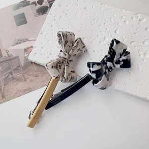 Detailed macro view of the France Handmade engraving on marble acetate hair clip backing