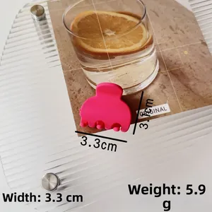 Detail view of pink hair claw clip with size dimensions 3.1cm width and 5.9g weight