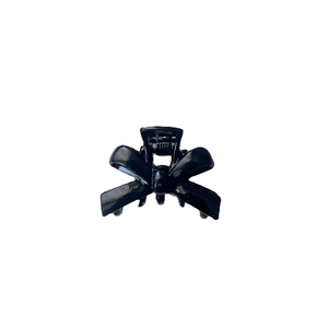 Elegant black bow-knot hair claw clip with metallic spring for versatile styling