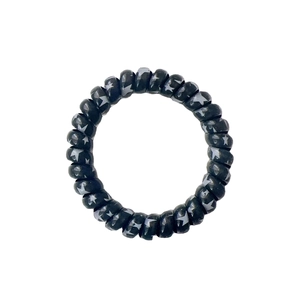 Spiral telephone cord hair ring in black with stylish silver star pattern details