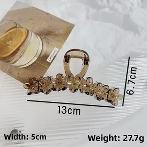 Detail view of large jelly brown flower hair claw clip with 13cm length measurement