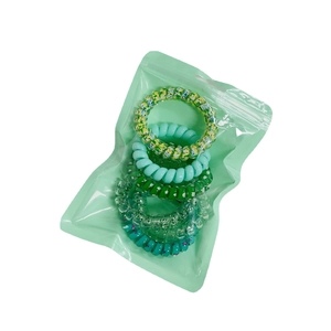 5-piece colorful spiral hair ties set with floral and polka dot patterns in clear bag