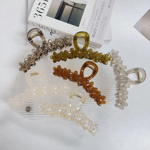 Detail of six colorful jelly flower hair claws made of high-quality acrylic materials