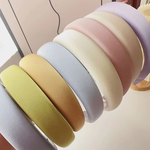Macro shot of colorful padded sponge headbands in various soft Morandi colors