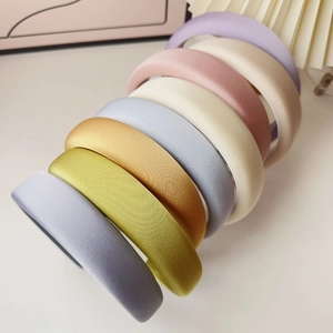 Detailed close-up showing texture and seven diverse colors of padded fabric headbands