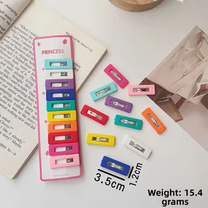 Close-up of 10-piece colorful rectangular geometric hair clips set for toddlers