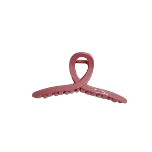 Pince à cheveux rose élégante en forme de ruban pour chignons avec fini brillant