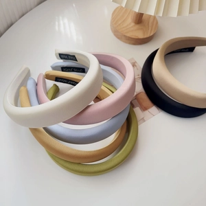 Selection of thick padded sponge headbands in various soft pastel colors and satin finish