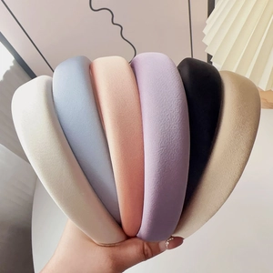 Detailed set of six colorful thick sponge headbands in white, blue, pink, and black
