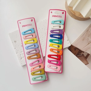 10-piece set of matte macaron color geometric BB hair clips for girls in a stylish display