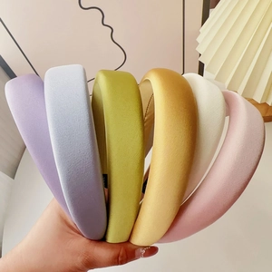 Close-up of six colorful padded sponge headbands with soft velvet texture and anti-slip lining