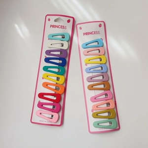 Detailed view of colorful matte water-drop hair clips on Princess branded packaging cards