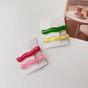 Set of four translucent jelly color wave hair clips in red pink green and yellow
