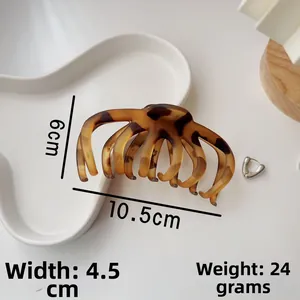 Detailed view of amber leopard hair claw clip showing 10.5cm length and size dimensions
