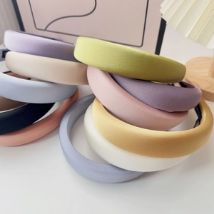 Close-up of colorful thick sponge headbands with a smooth matte texture fabric