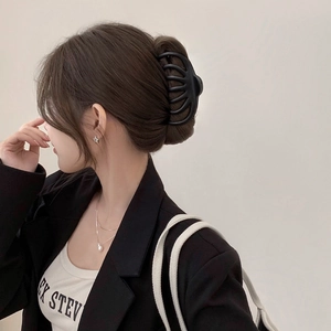 French style matte black large hair claw clip for thick hair shown on a model