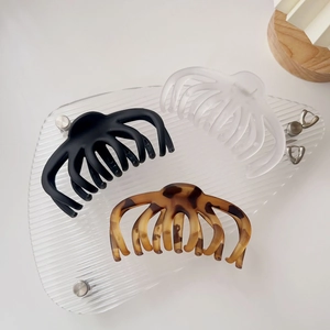 Three-piece large hair claw clips set in matte black, frosted white and tortoiseshell pattern