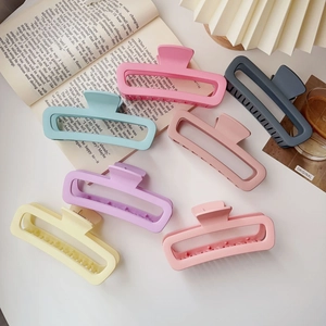 Assorted set of 7 matte rectangular hair claw clips in trendy pastel colors for women.