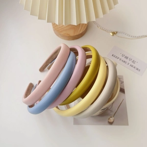 Close-up of padded leather headbands in macaron colors for high top hair style