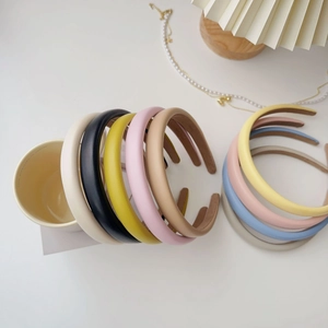 Close-up of colorful PU leather sponge headbands in minimalist Morandi tones