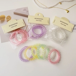 Lot de 2 chouchous spirales colorés aux tons pastel avec structure en résine flexible
