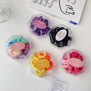 Five hexagonal boxes with colorful high elasticity hair ties and stylish wave texture