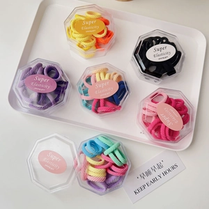 Set of 6 high-elasticity colorful hair ties in transparent hexagonal storage boxes