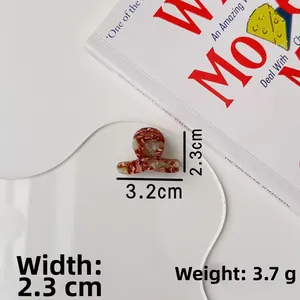 Macro detail of tortoiseshell acetate hair claw clip showing precise 3.2cm size measurements
