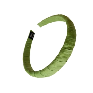 Green fabric headband with twisted pleats and handmade label for high cranial top hair look