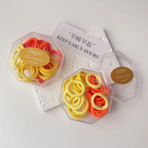 Colorful high elasticity hair ties set in a premium hexagonal box with gold labels