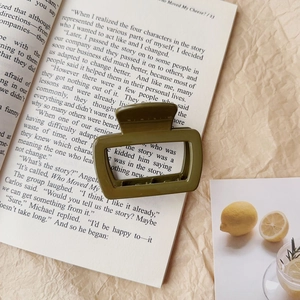 Large olive green acrylic hair claw clip with a matte finish for hair styling