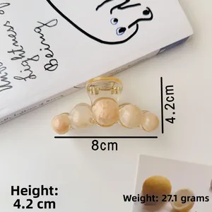 Amber texture acrylic claw clip with five round beads detail and size measurements