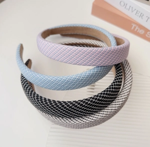 Detail view of four-color sponge headbands with twill fabric texture and non-slip lining