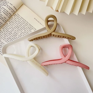 Three-piece set of large matte hair claws in khaki, cream, and pink for women