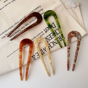 Detail of five-piece acetate U-shaped hairpins with tortoiseshell and marble patterns