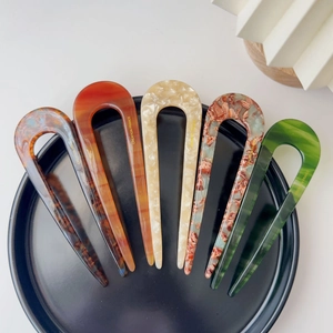Detailed set of five acetate U-shaped hair pins in diverse tortoiseshell and marble patterns