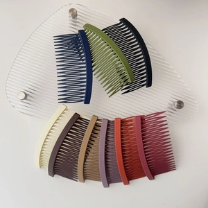 Detail of matte hair side combs in multiple colors for securing bangs and hairstyles