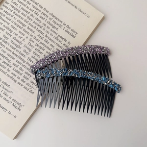 Close-up detail of elegant hair side combs decorated with colorful sparkling rhinestones
