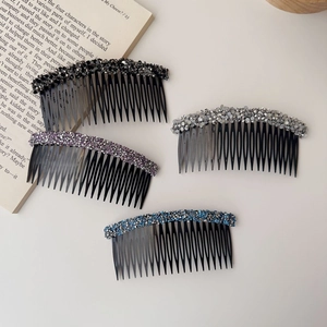 Detail of four colorful hair side combs with sparkling rhinestones in a flat lay view