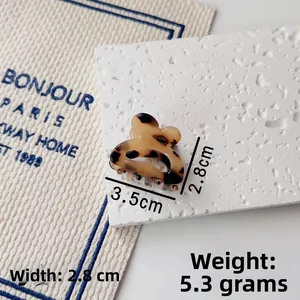 Detail view of small 3.5cm tortoise shell hair claw clip showing size measurements