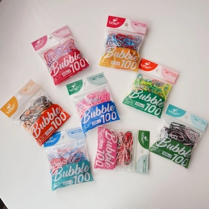 Flat lay of 100-piece candy color high elastic hair ties in clear hanging bags