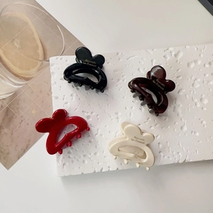 Set of four glossy resin butterfly hair claws in black, burgundy, coffee, and cream colors