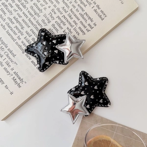 Y2K double star hair clips in black and silver glitter with a minimalist blogger aesthetic