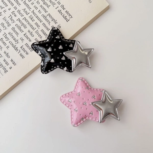 Chic Y2K star hair clips in black and pink patent leather with silver glitter and metal star