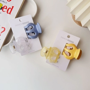 Assorted jelly color pumpkin hair claws in blue and yellow on fashion display card