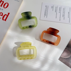 Three matte jelly color hair claws with rectangle cut-out and ink-wash texture details