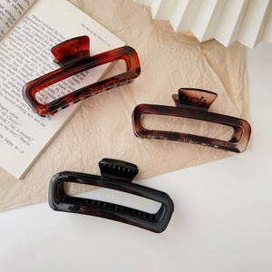 Three large acrylic claw clips in tortoiseshell, coffee, and black for long hair styling